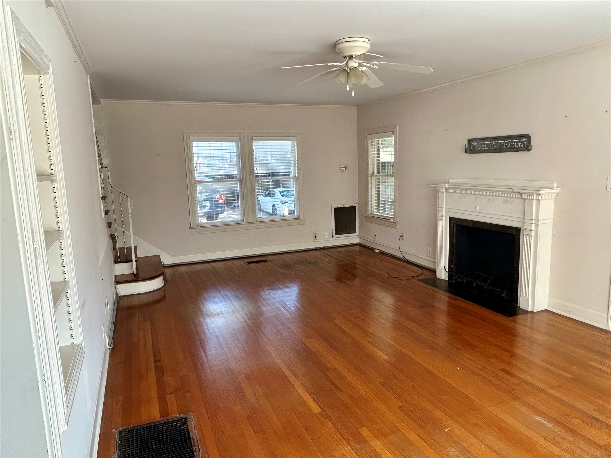 2038 Lexington Street Houston, TX 77098 - Photo 6 of 21 a view of an empty room with wooden floor and a window