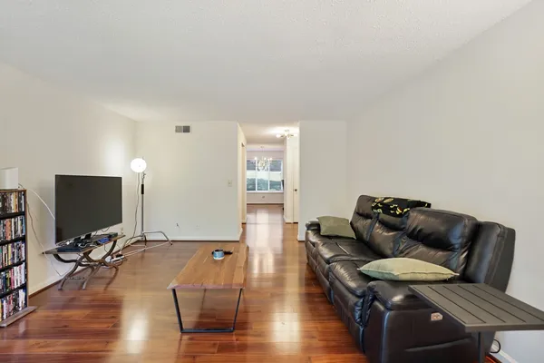 a view of balcony with wooden floor