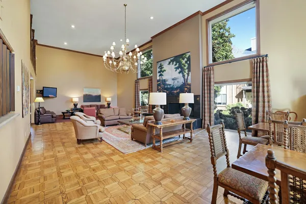 a dining room with furniture and wooden floor