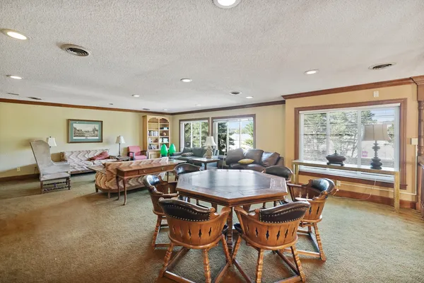 a view of a dining room with furniture window and outside view