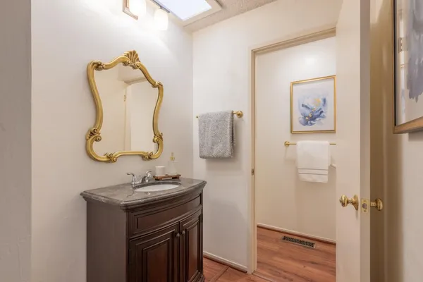 a bedroom with a bed and a lamp