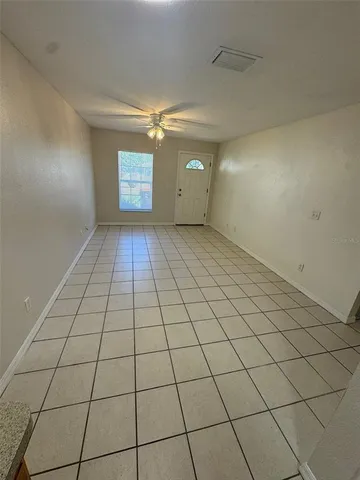 a kitchen with stainless steel appliances granite countertop a refrigerator and a stove