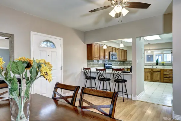 a view of a dining room with furniture and wooden floor