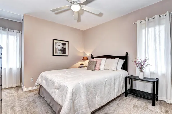 a bedroom with bed and window