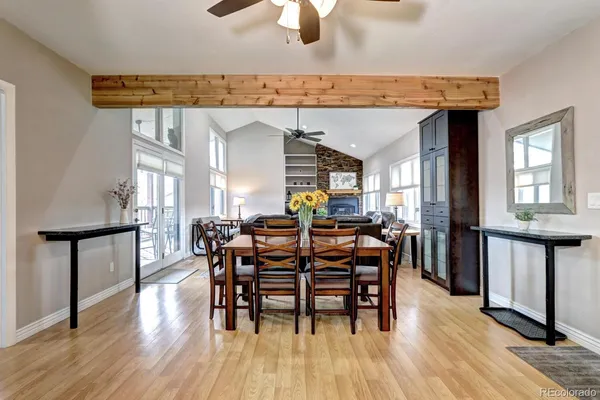 a view of a dining room with furniture and wooden floor