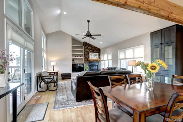 a view of a dining room with furniture window and wooden floor