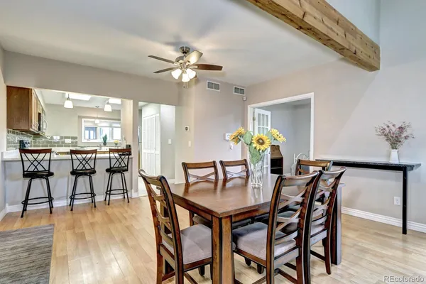 a view of a dining room with furniture and wooden floor