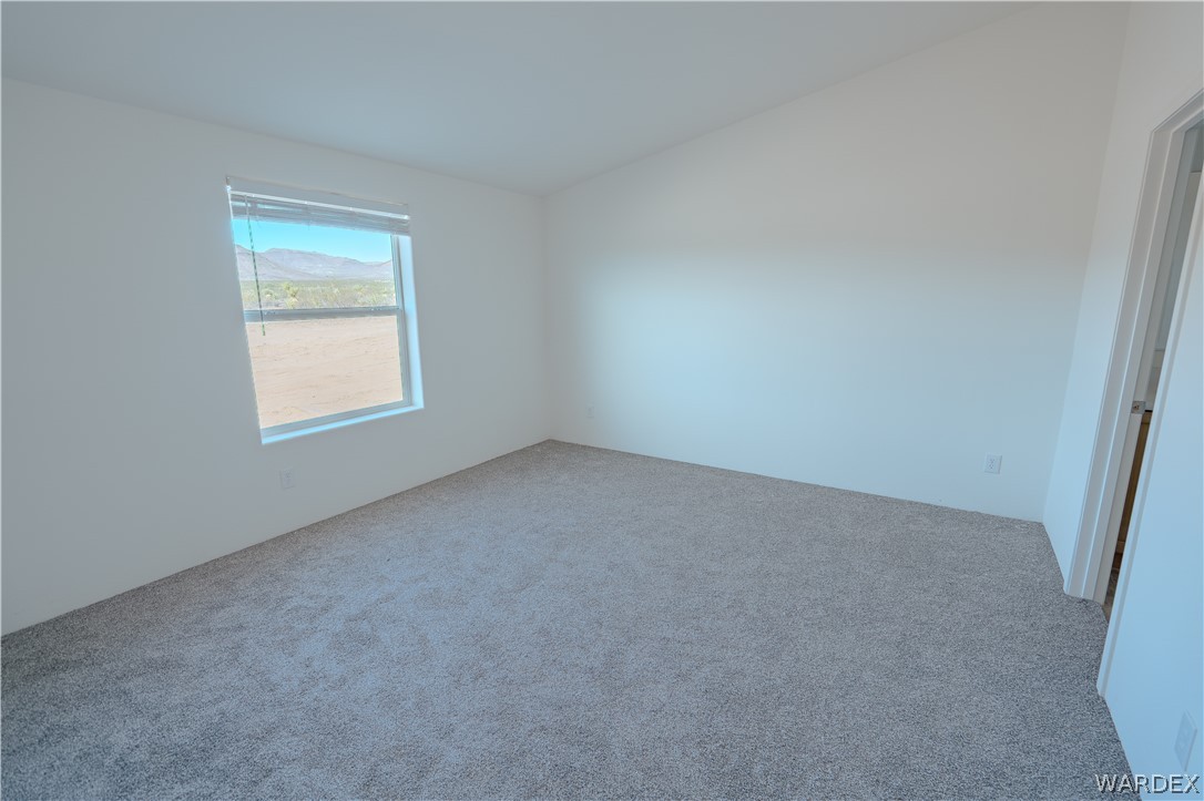 5746 Eden Road Golden Valley, AZ 86413 - Photo 12 of 27 an empty room with a window