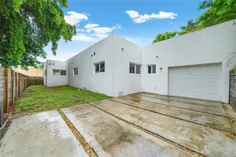 a house view with a backyard space