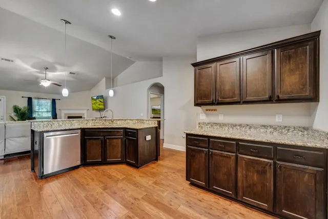 a view of kitchen with cabinets and wooden floor