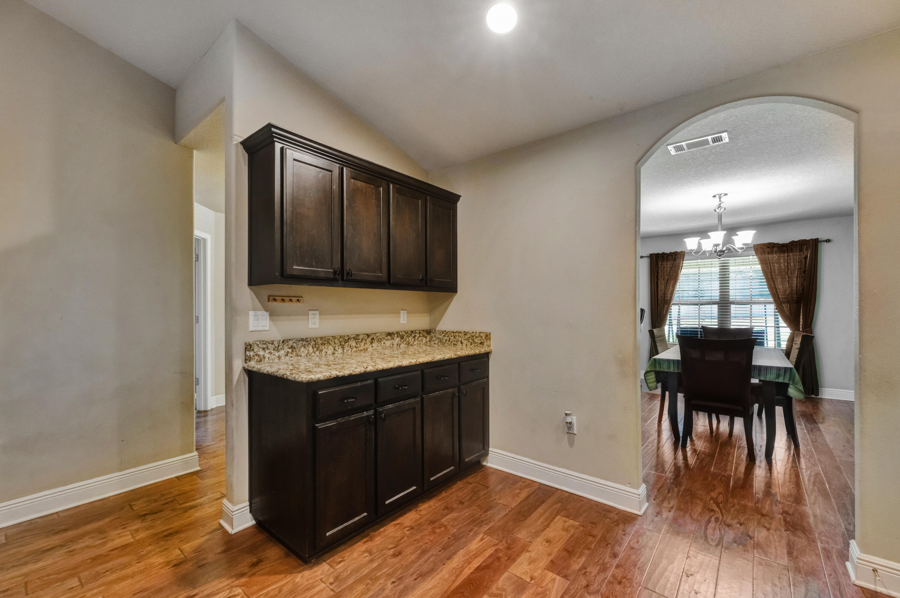 2428 Genevieve Way Crestview, FL 32536 - Photo 18 of 53 a view of kitchen with cabinets and wooden floor