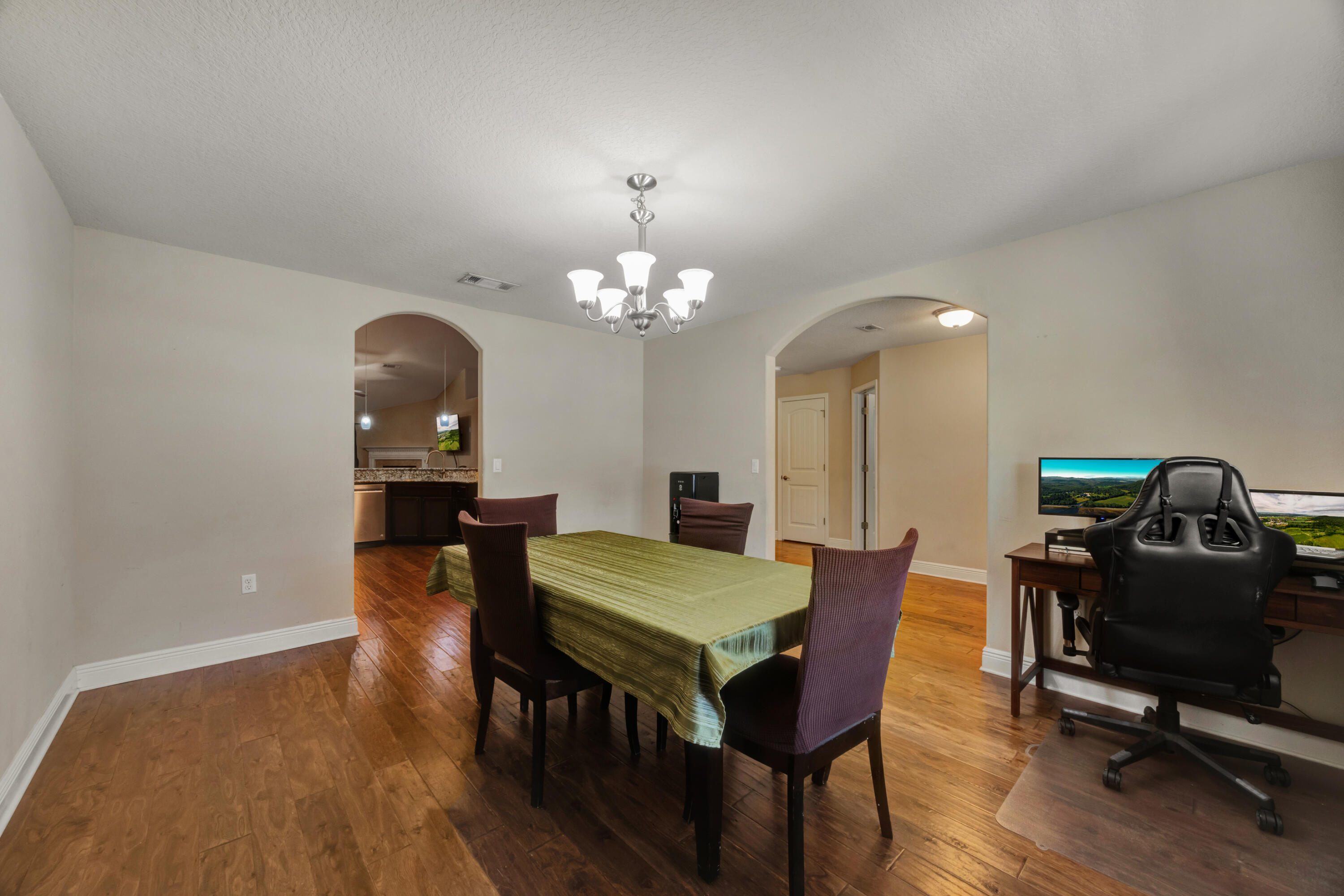 2428 Genevieve Way Crestview, FL 32536 - Photo 21 of 53 a view of a dining room with furniture and wooden floor