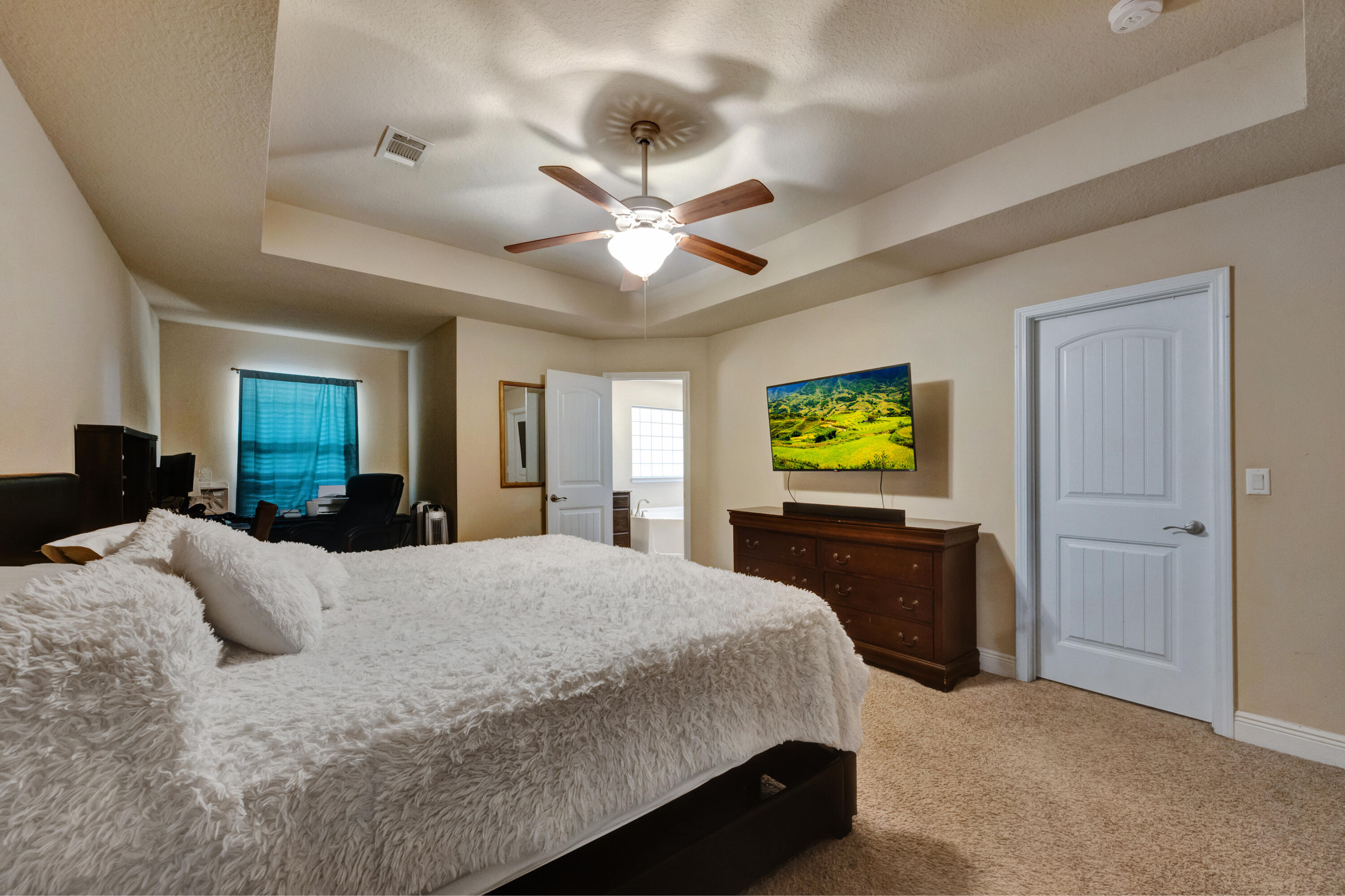 2428 Genevieve Way Crestview, FL 32536 - Photo 22 of 53 a bedroom with a bed and a chandelier