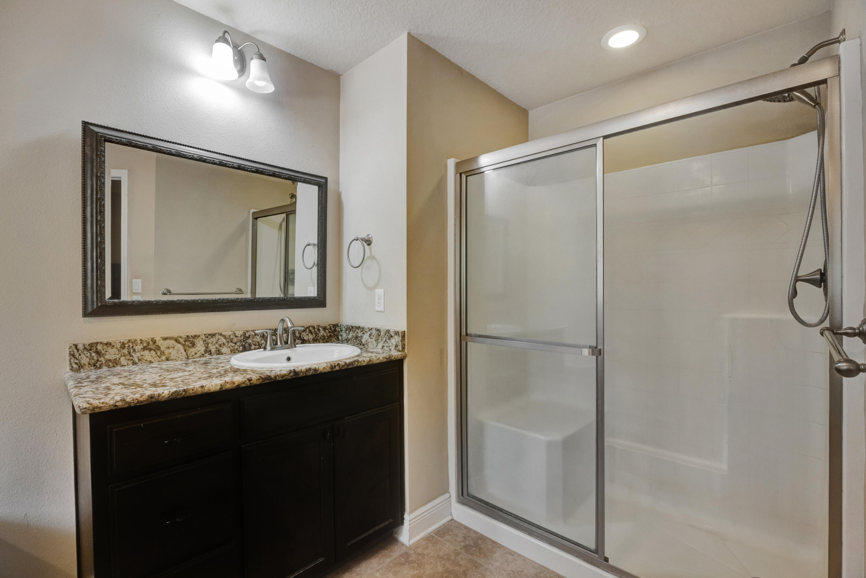 2428 Genevieve Way Crestview, FL 32536 - Photo 25 of 53 a bathroom with a double vanity sink mirror and shower