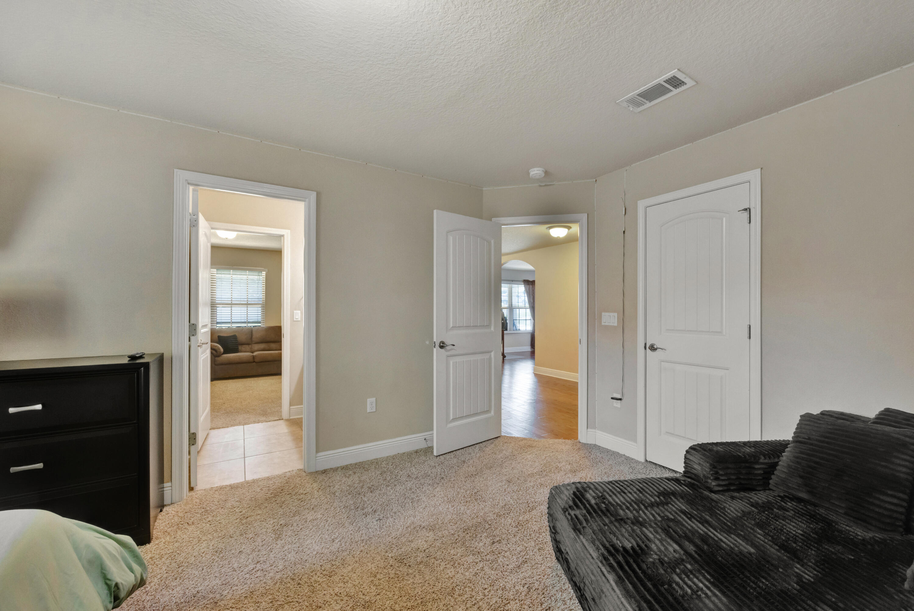 2428 Genevieve Way Crestview, FL 32536 - Photo 28 of 53 a bedroom with a bed and a walk in closet