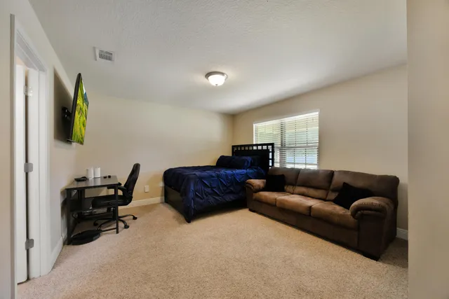 a living room with a couch and a stove