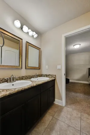 a spacious bedroom with a bed and a window