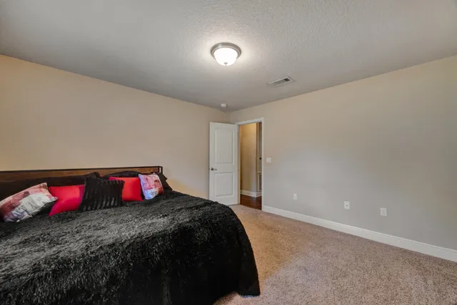 a white toilet sitting next to a bath tub and a shower