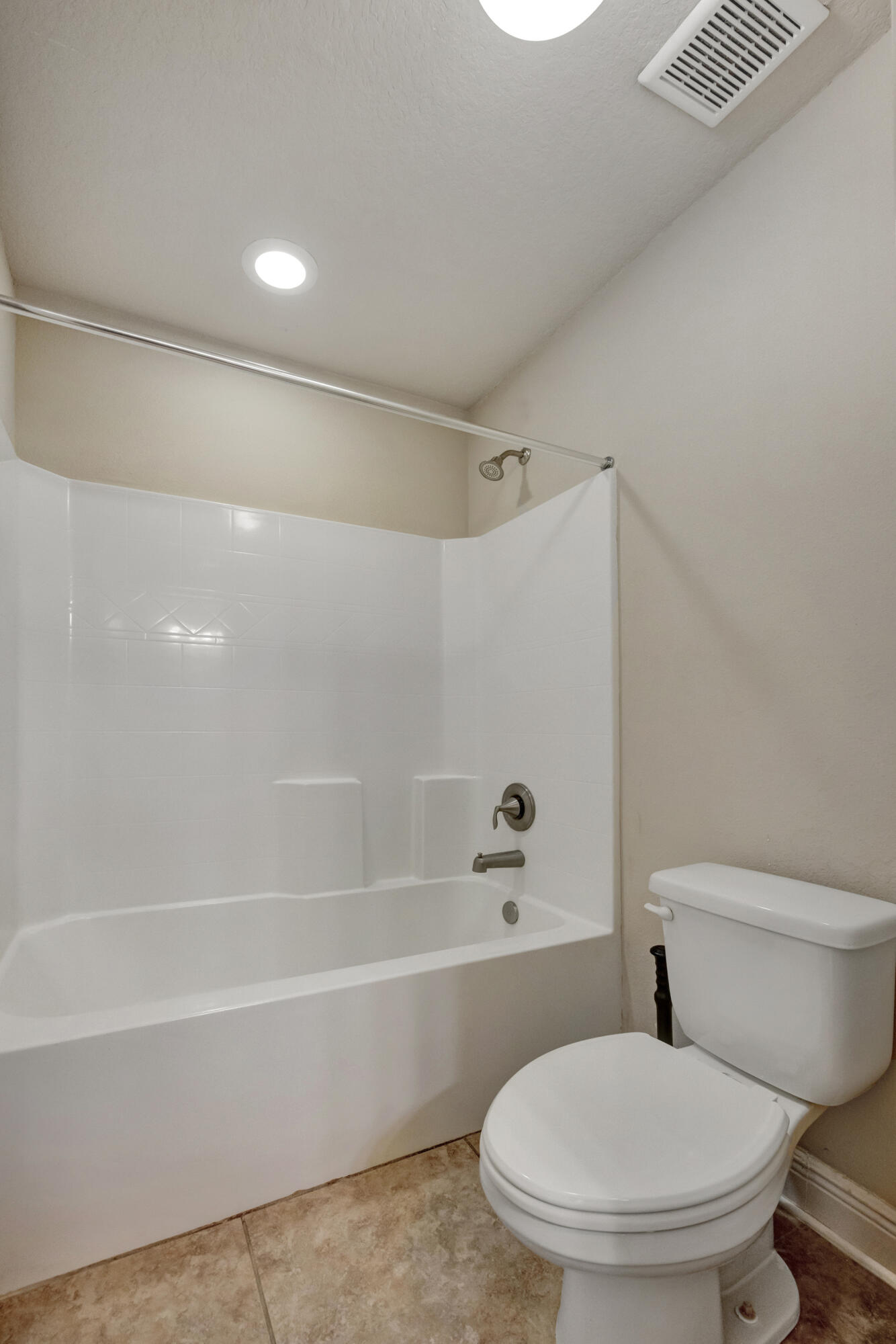 2428 Genevieve Way Crestview, FL 32536 - Photo 37 of 53 a white toilet sitting next to a bath tub and a shower