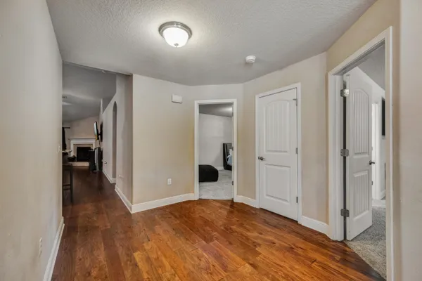 a living room with furniture fireplace and a window