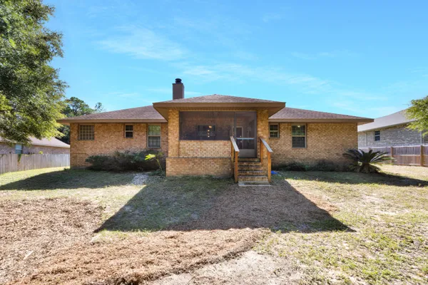 a view of a house with a yard porch and sitting area
