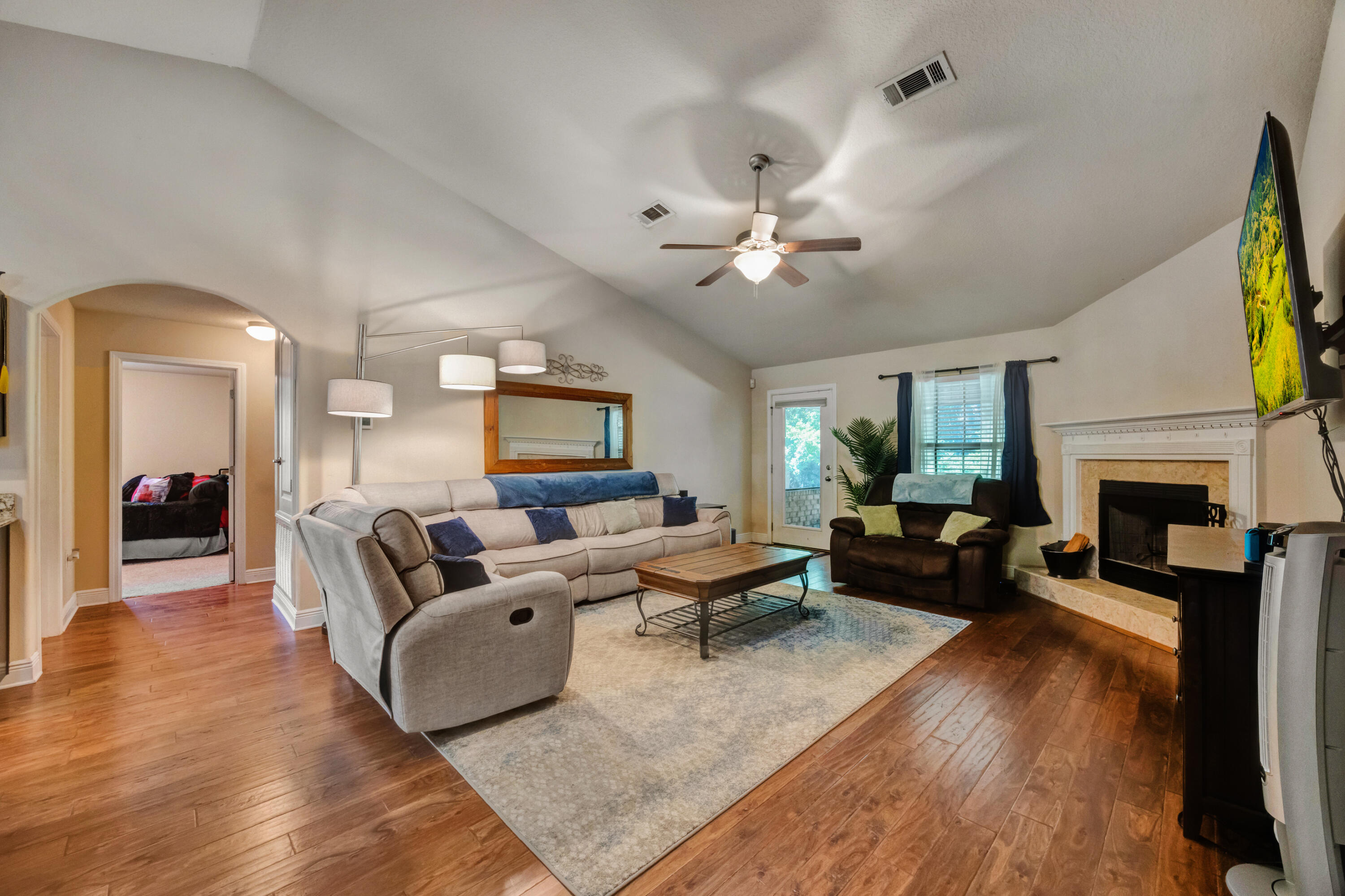 2428 Genevieve Way Crestview, FL 32536 - Photo 5 of 53 a living room with furniture fireplace and a window