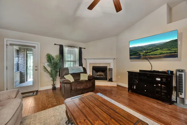 a living room with furniture and a fireplace
