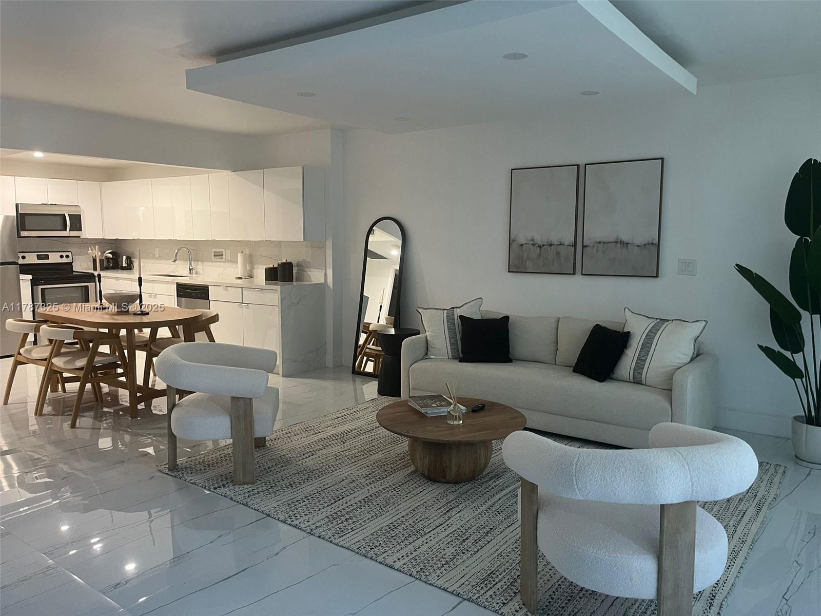 2301 Collins Avenue, Unit 628 Miami Beach, FL 33139 - Photo 14 of 25 a living room with furniture and a large window