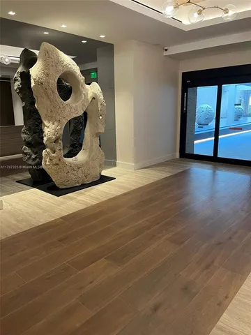 a view of a room with wooden floor