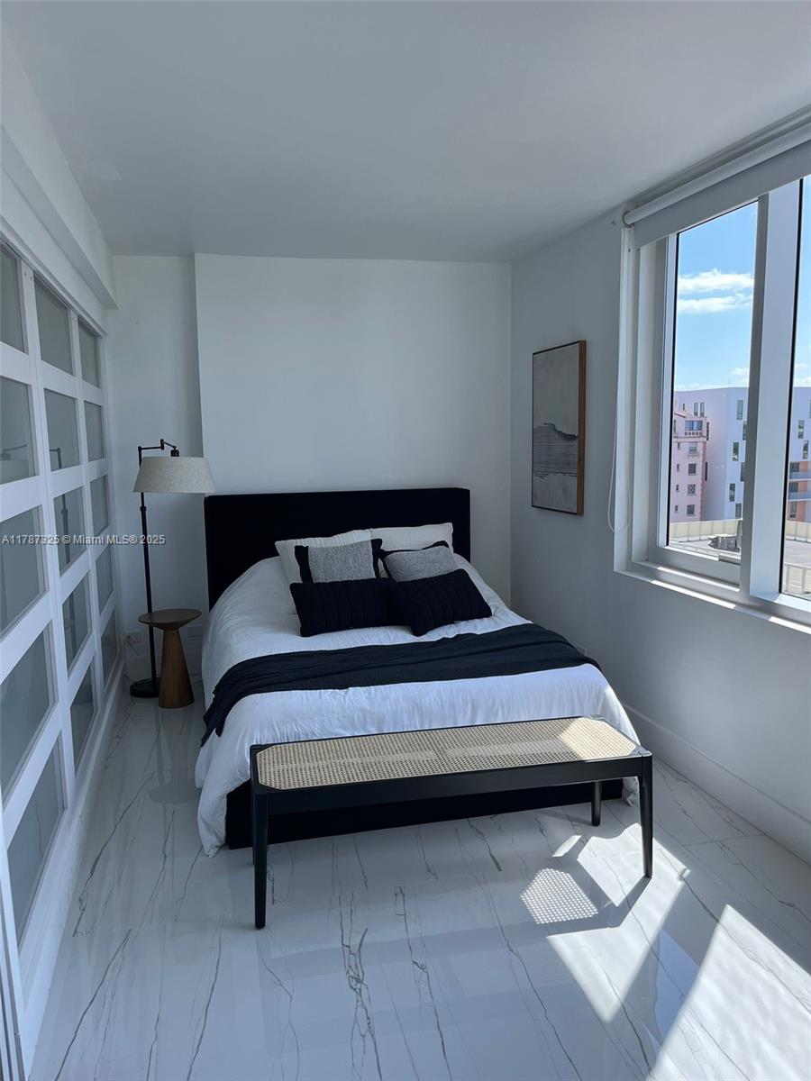 2301 Collins Avenue, Unit 628 Miami Beach, FL 33139 - Photo 7 of 25 a bedroom with a bed and window