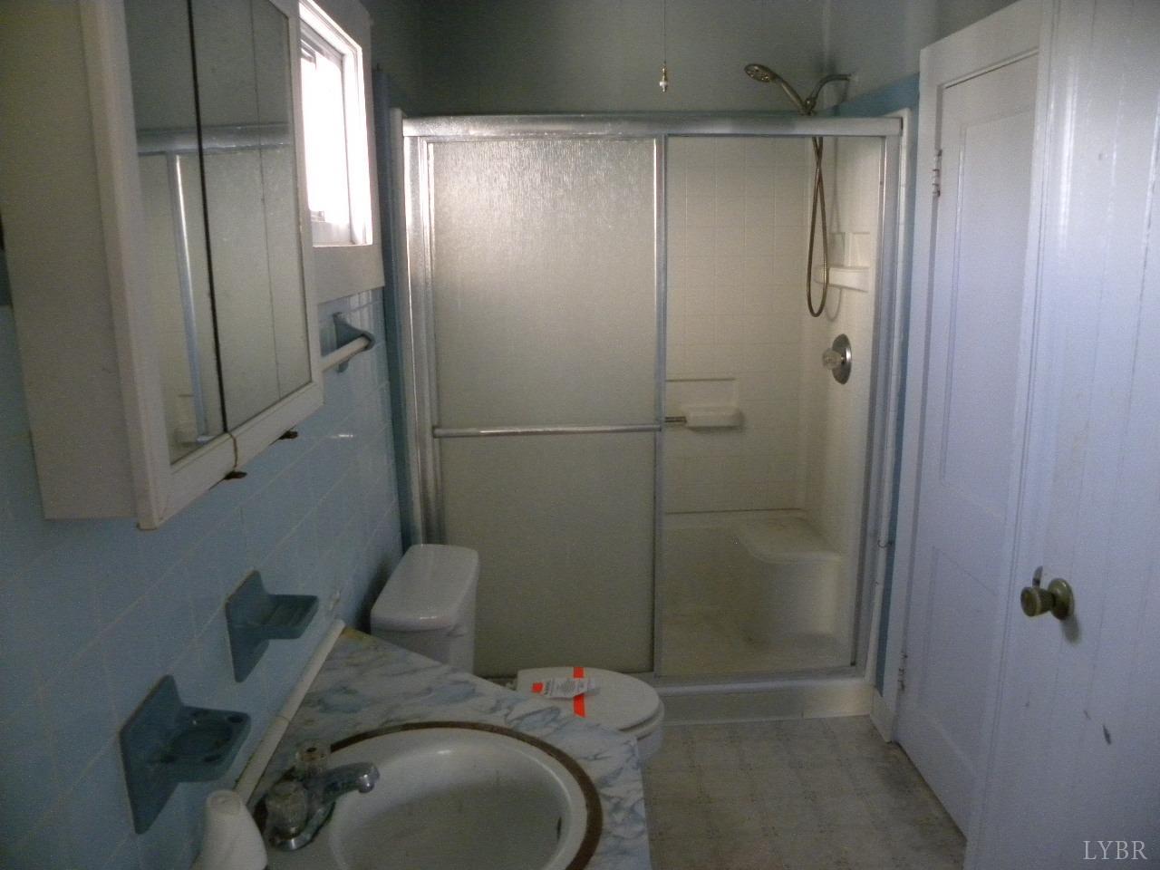 5797 Scuffletown Road Randolph, VA 23962 - Photo 10 of 18 a bathroom with a shower and toilet