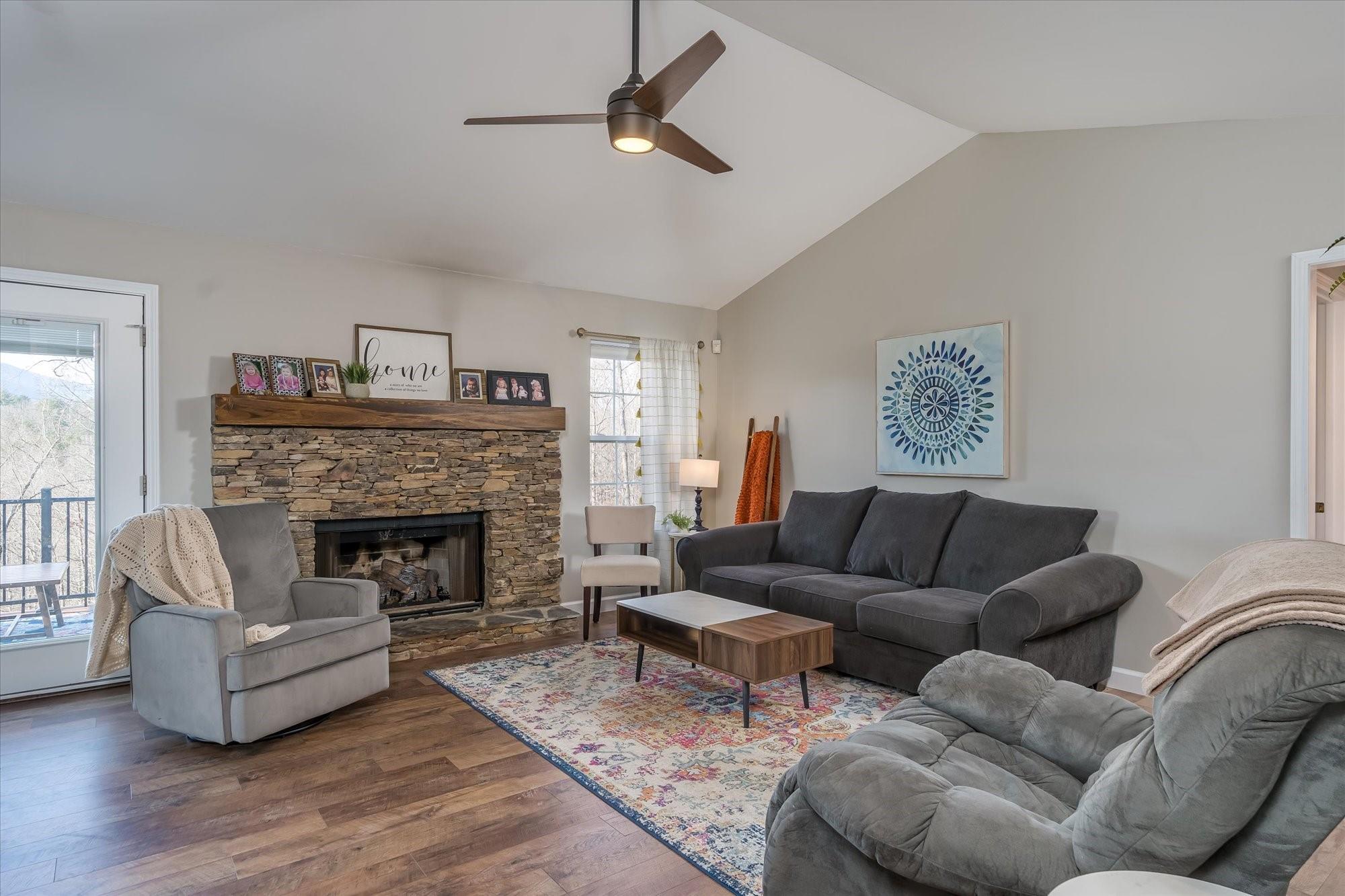 531 Sloping Meadow Mill Spring, NC 28756 - Photo 13 of 46 a living room with furniture and a fireplace