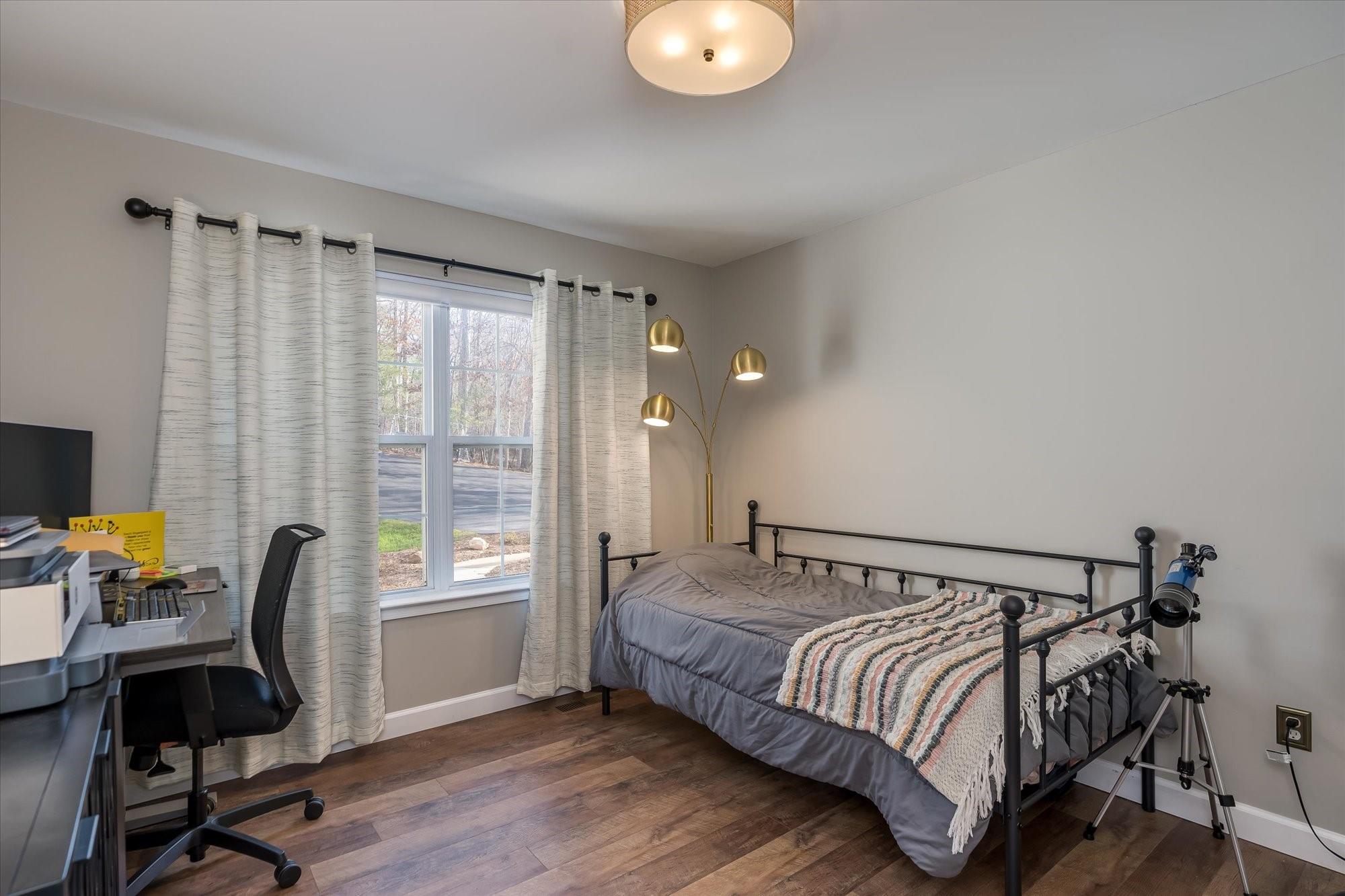 531 Sloping Meadow Mill Spring, NC 28756 - Photo 19 of 46 a bedroom with a bed and a window