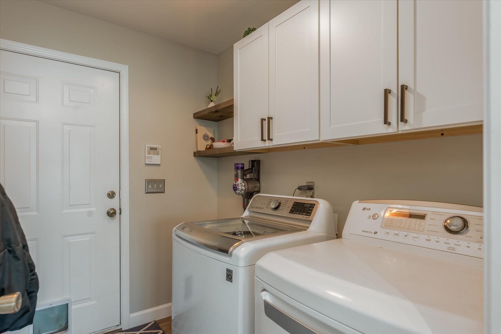 531 Sloping Meadow Mill Spring, NC 28756 - Photo 23 of 46 a utility room with dryer and washer