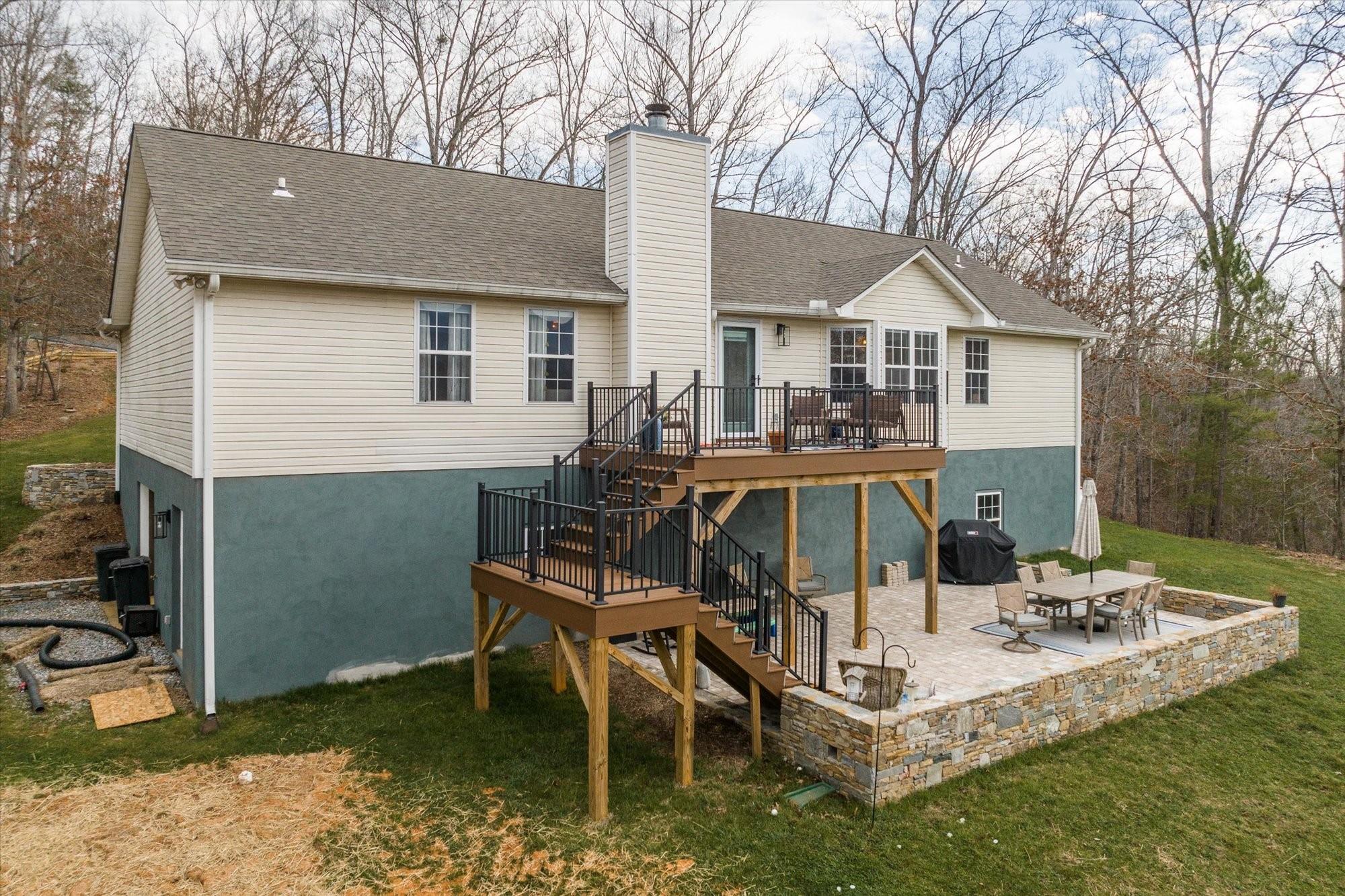 531 Sloping Meadow Mill Spring, NC 28756 - Photo 32 of 46 a view of a house with backyard and sitting area