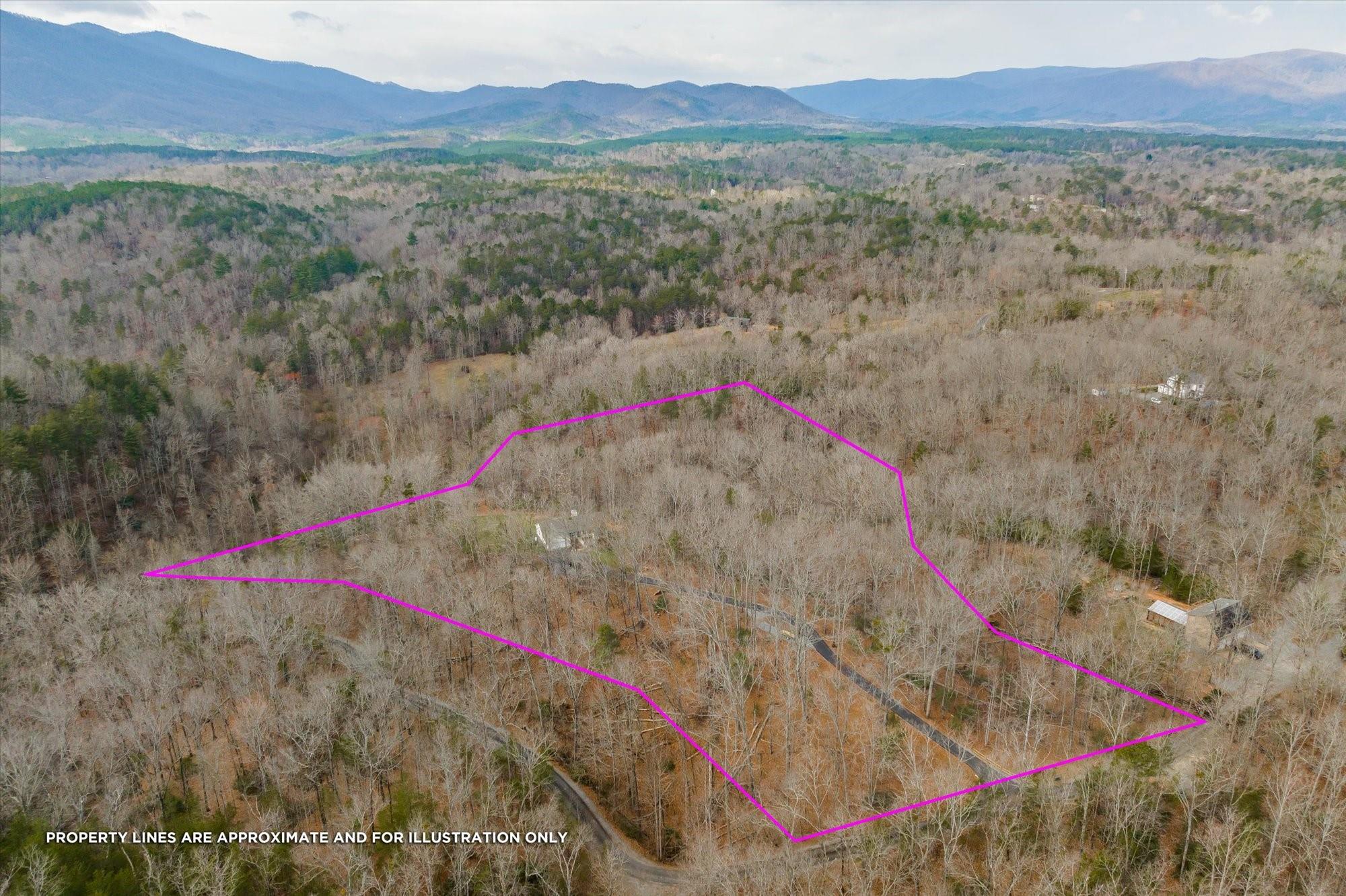531 Sloping Meadow Mill Spring, NC 28756 - Photo 35 of 46 a view of lake with a yard