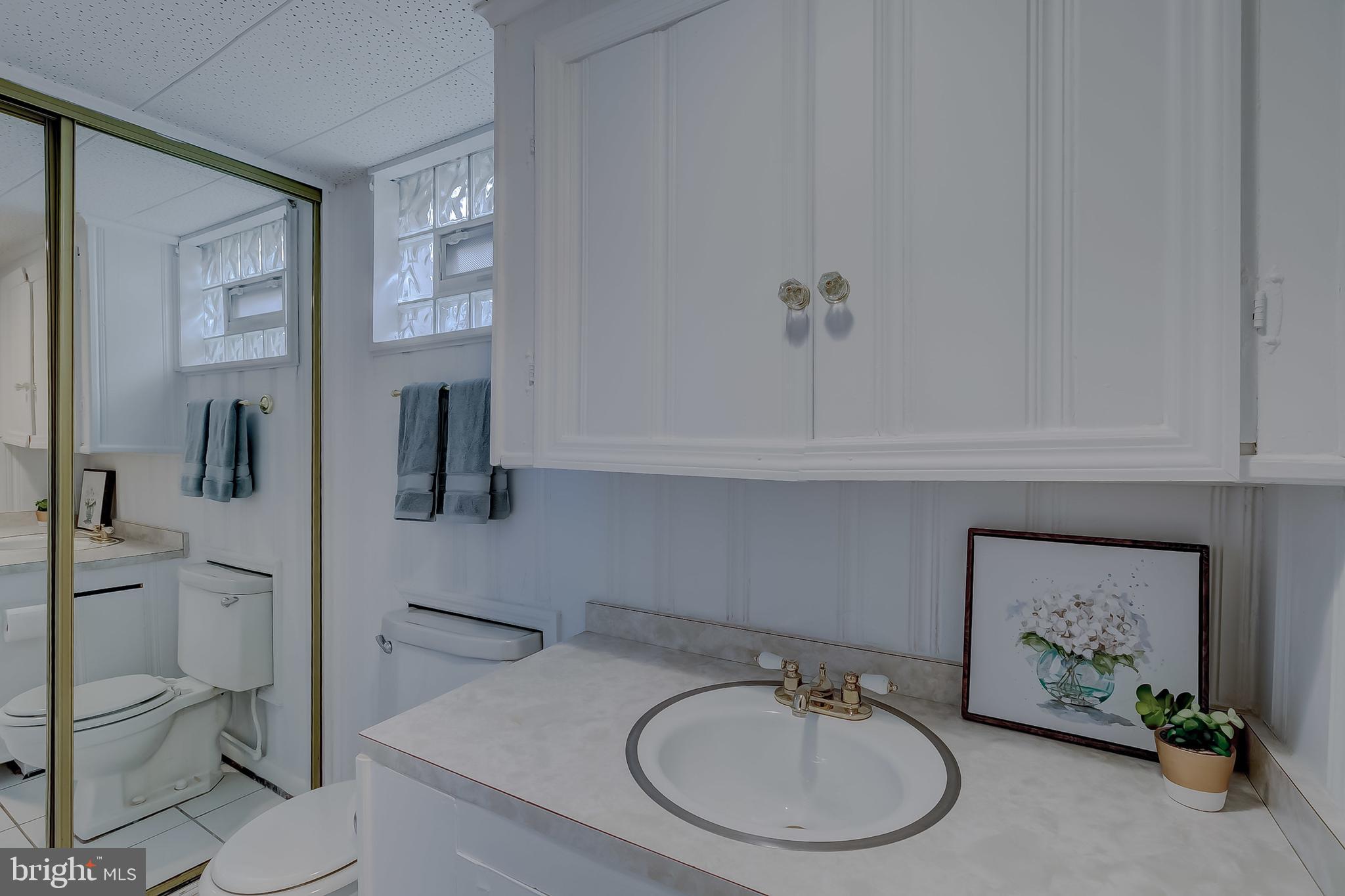 604 Norhurst Way Baltimore, MD 21228 - Photo 28 of 48 Lower level half Bath w/large storage closet