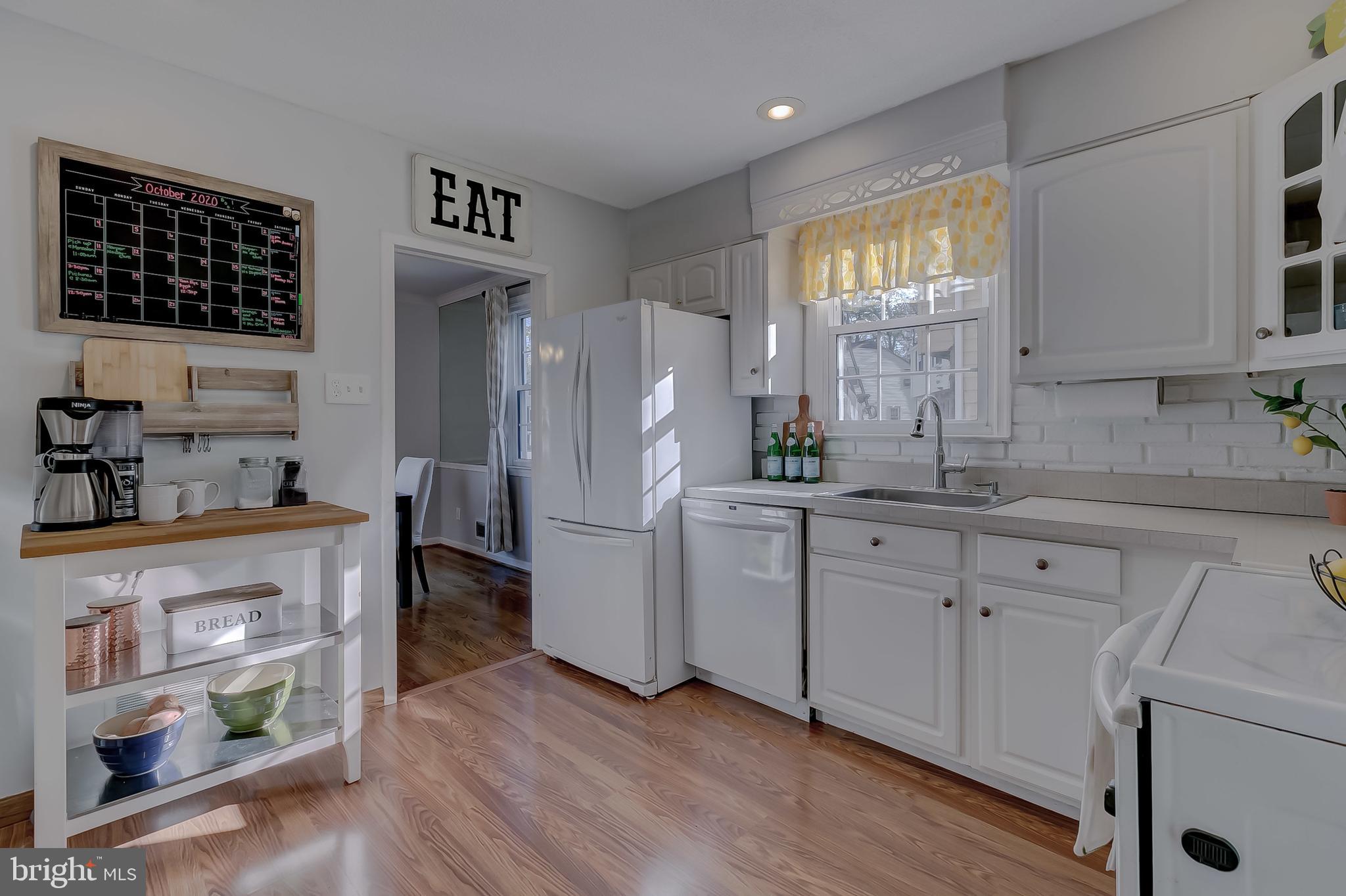 604 Norhurst Way Baltimore, MD 21228 - Photo 10 of 48 White counters, cabinets & decorative backsplash