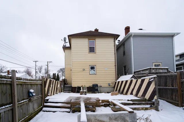 a balcony with a table and chairs