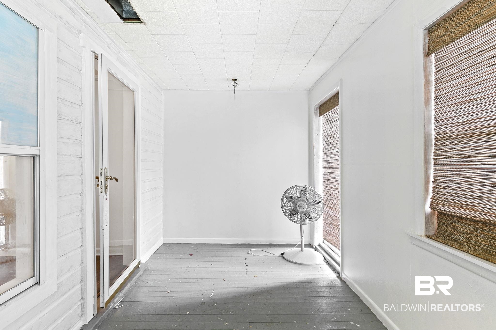 316 West Orchid Avenue Foley, AL 36535 - Photo 24 of 38 Corridor with baseboards and light wood finished floors