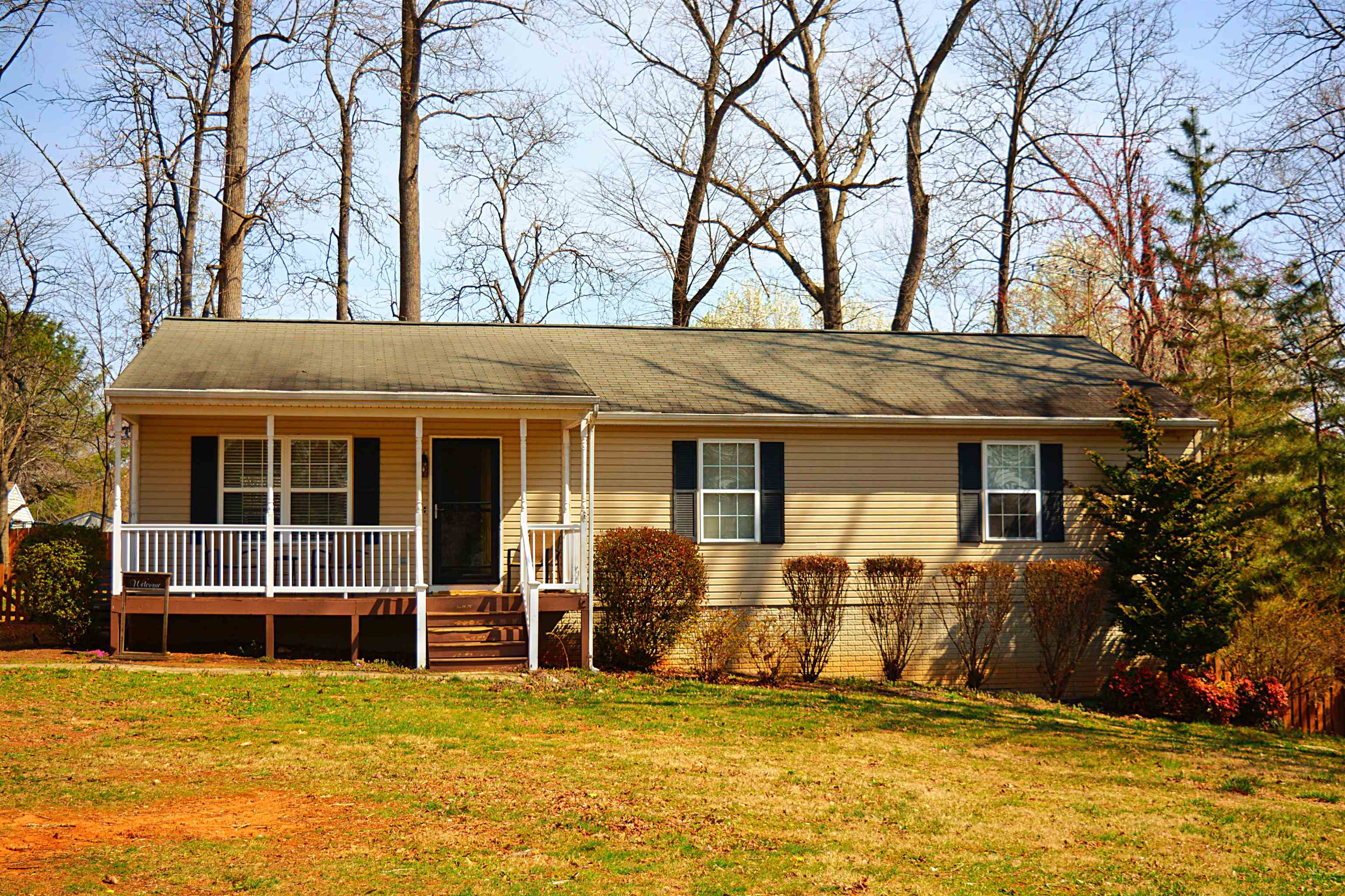 114 William Road Ruckersville, VA 22968 - Photo 1 of 19 a view of a house with large windows and a tree