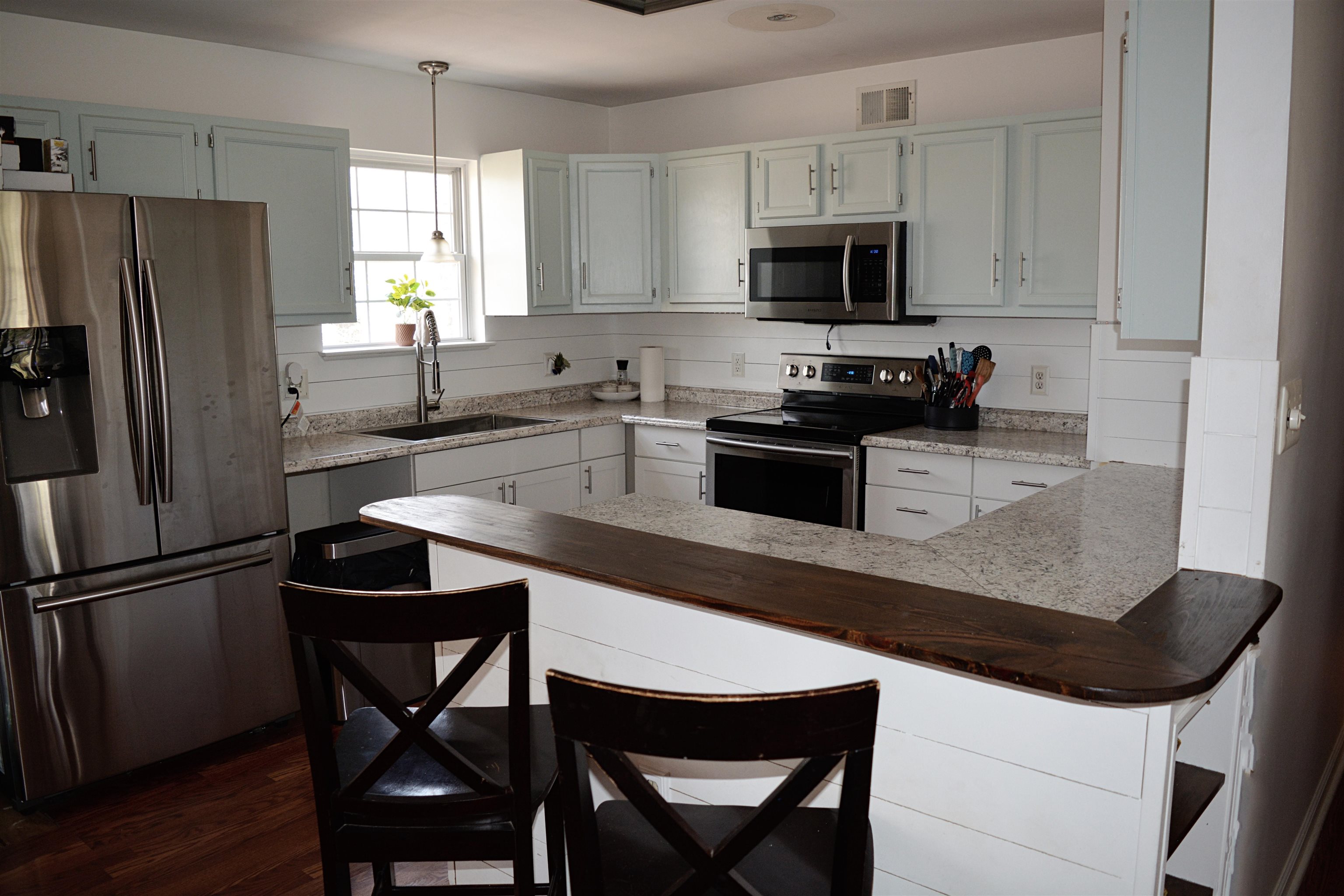 114 William Road Ruckersville, VA 22968 - Photo 7 of 19 a kitchen with granite countertop a refrigerator stove microwave and cabinets