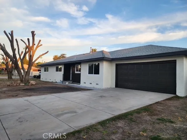 a front view of a house with a garage
