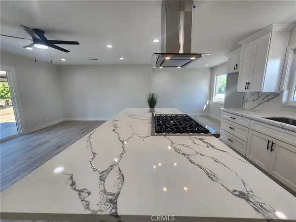 a kitchen with a sink stainless steel appliances and cabinets