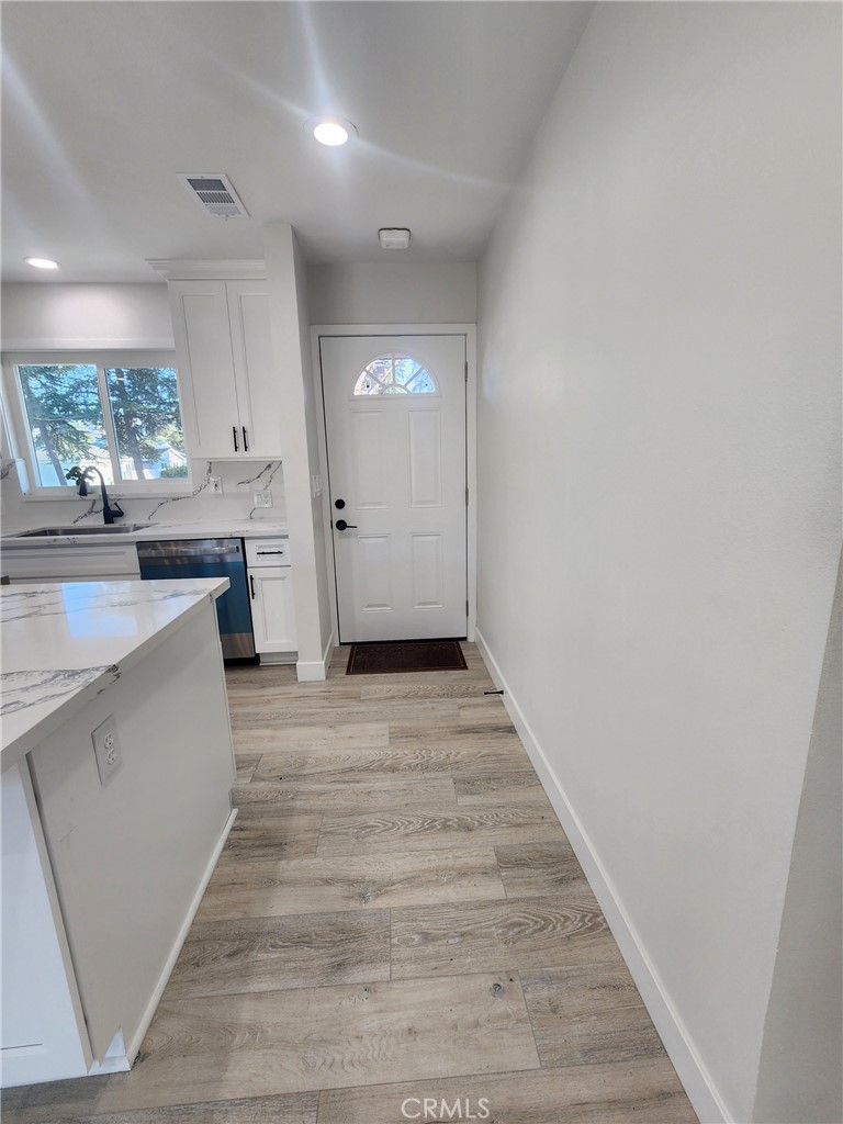 693 West Wilson Street Banning, CA 92220 - Photo 26 of 48 a view of a kitchen from the hallway