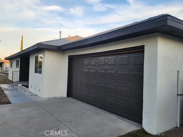 a view of wooden house with a large window