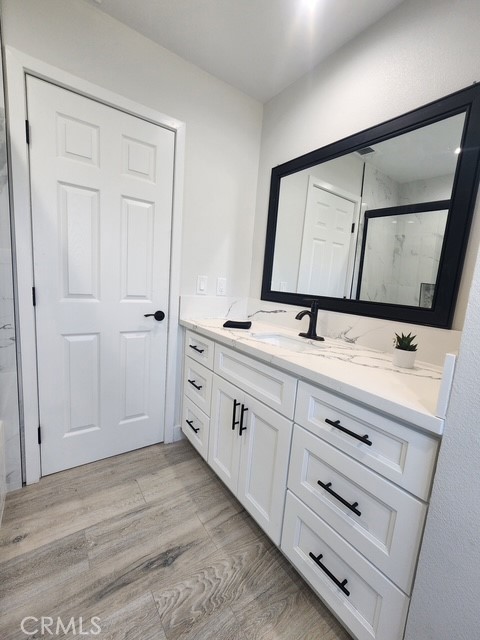 693 West Wilson Street Banning, CA 92220 - Photo 37 of 48 a bathroom with a sink and a mirror