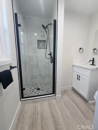 a view of a bathroom with a sink and mirror