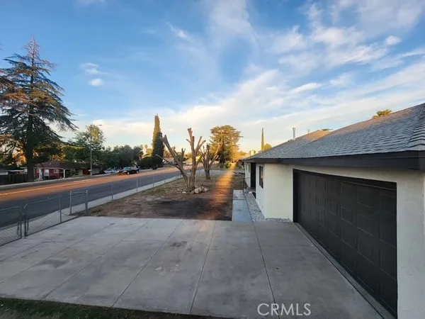 a view of street along with trees