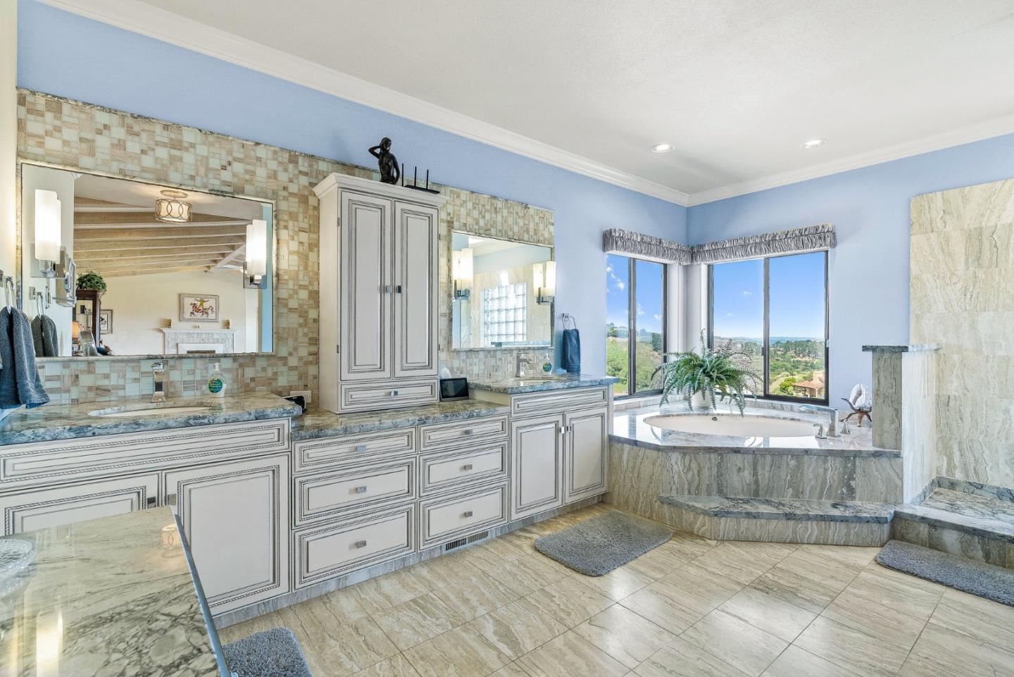 25611 Whip Road Monterey, CA 93940 - Photo 20 of 29 a large bathroom with a large tub sink and mirror